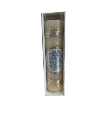 Decorative bottle in a box on a wooden surface with a blurred background