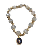 GOLD AND COLORFUL BRACELETS WITH DIFFERENT MEDALS